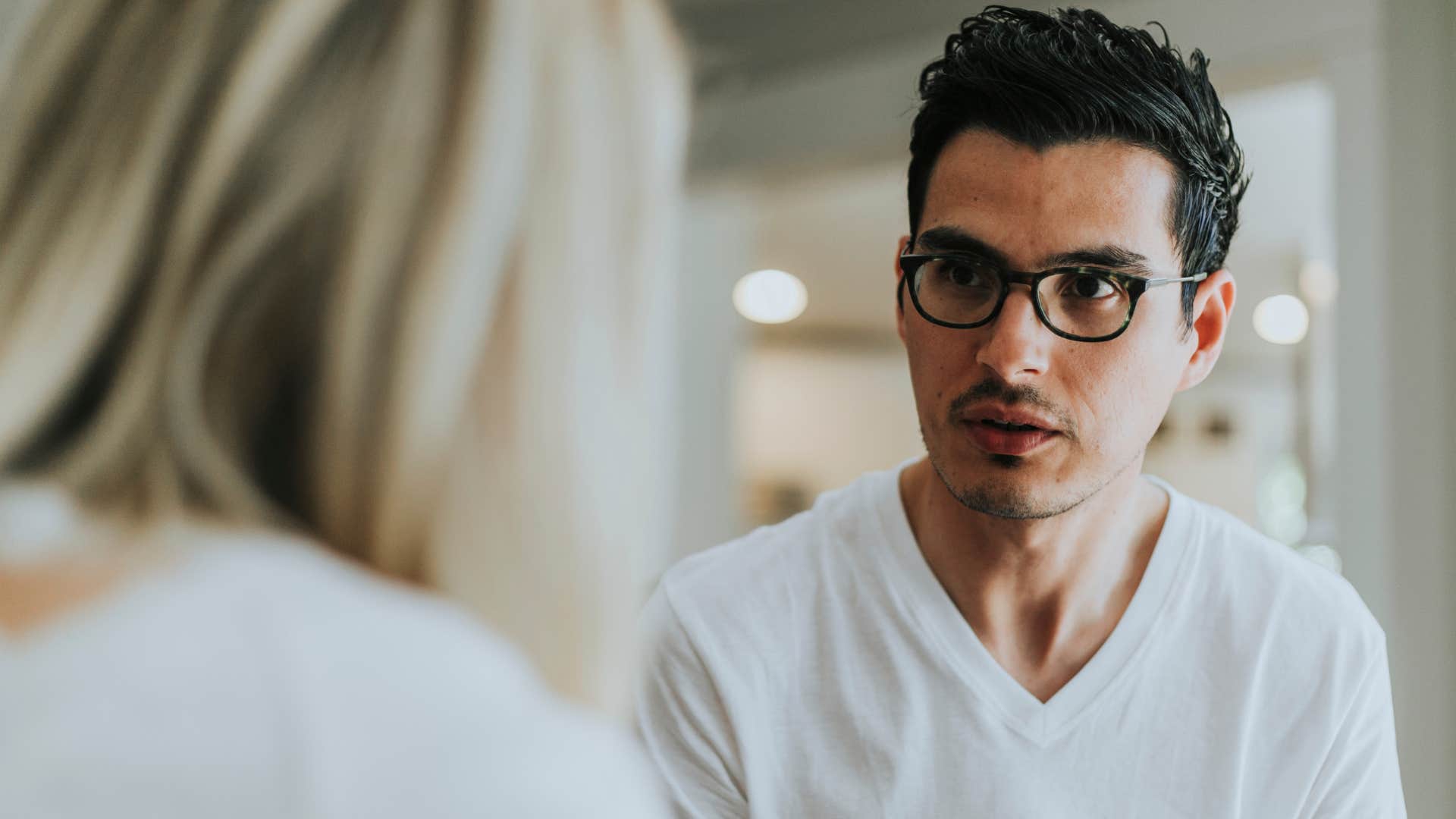 woman talking to a man with passive-aggressive communication style