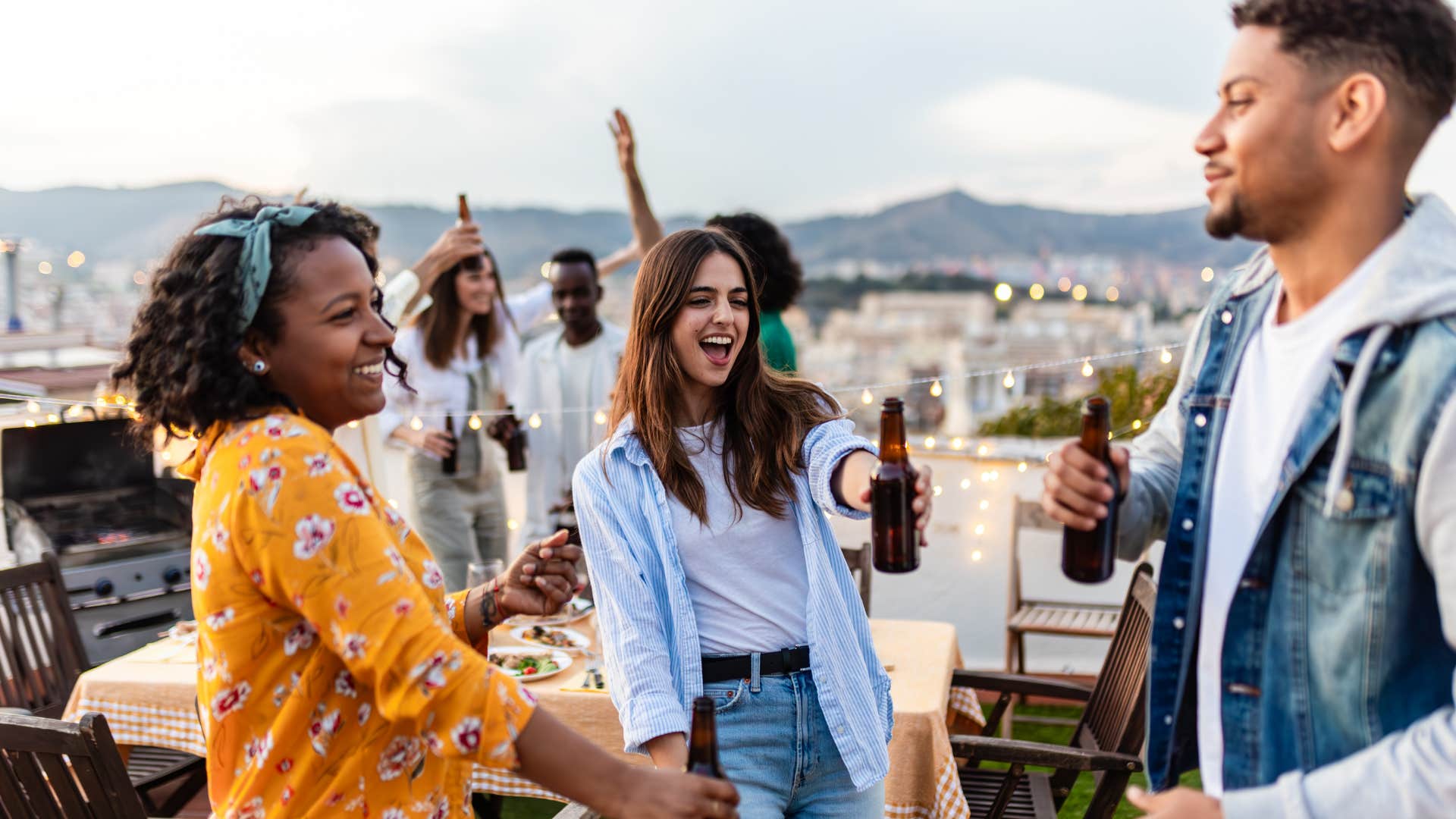 Excited people at party showing extroverts get you off your phone