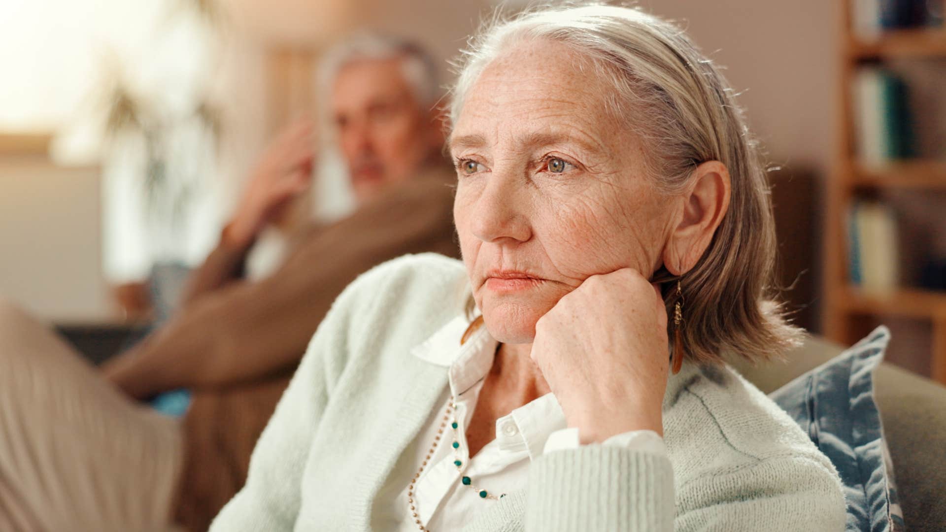 pessimistic woman turned away from her husband feeling bitter