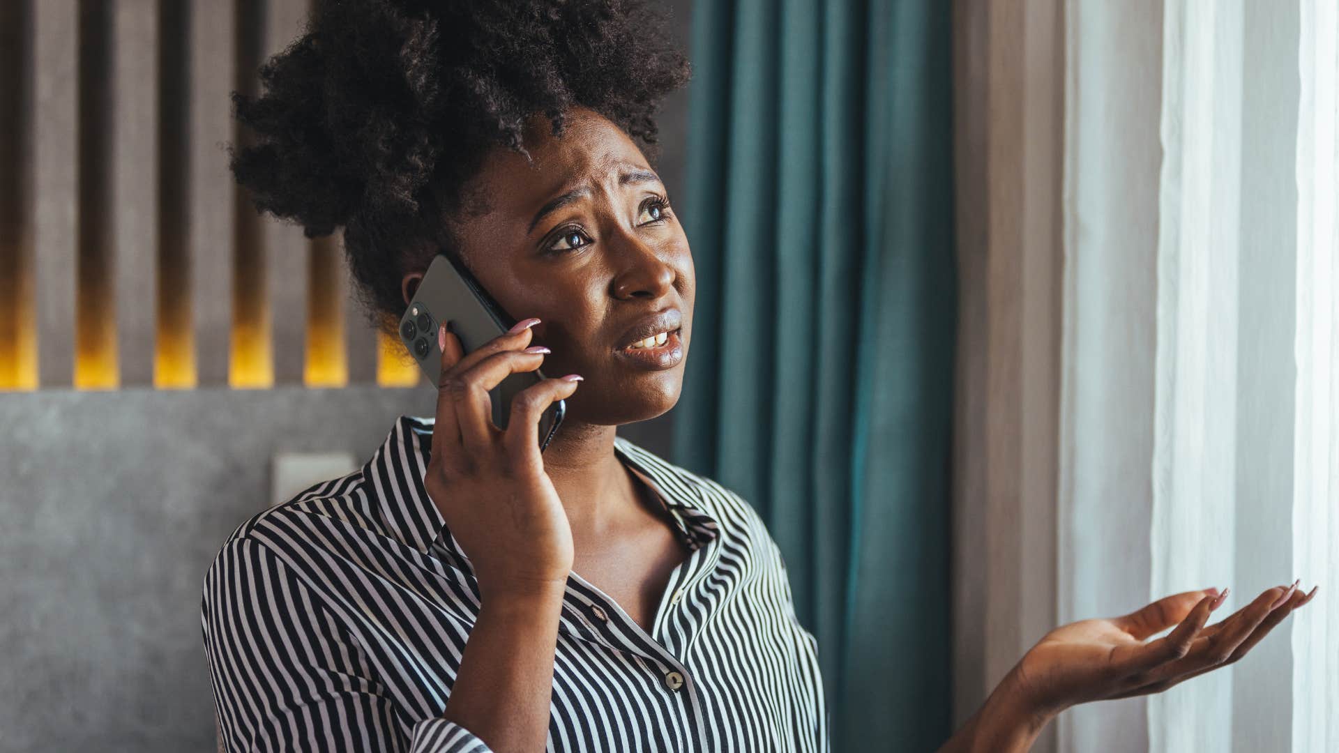 woman who's a chronic complainer talking on the phone
