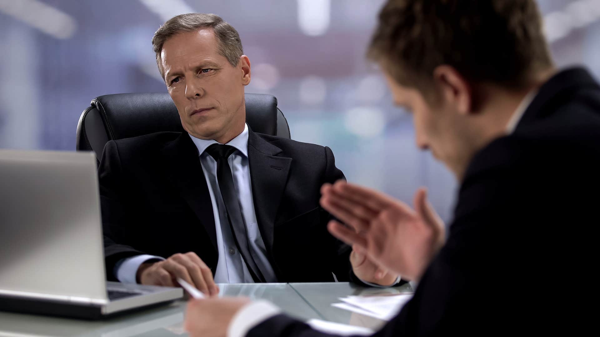 bitter man with a misguided sense of superiority talking at work