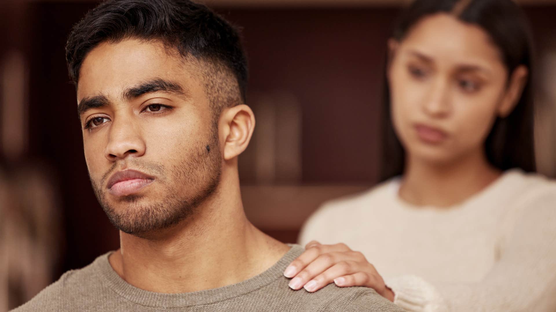 bitter and passive-aggressive man turned away from his wife