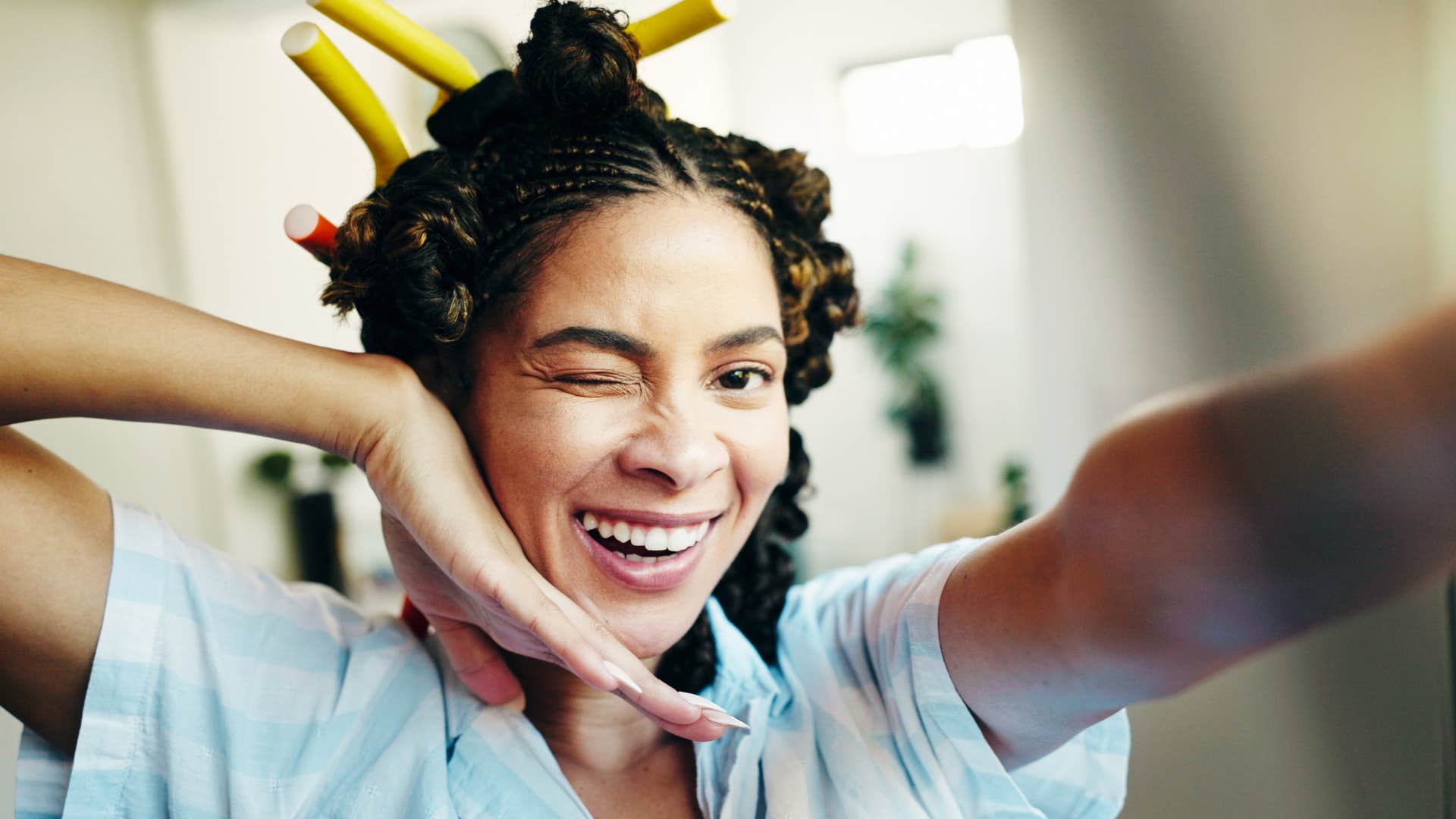 carefree woman smiling while getting ready