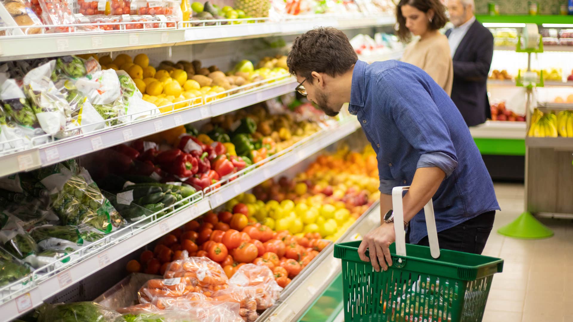man avoiding eye contact with everyone at the grocery store because he gets anxious in social situations