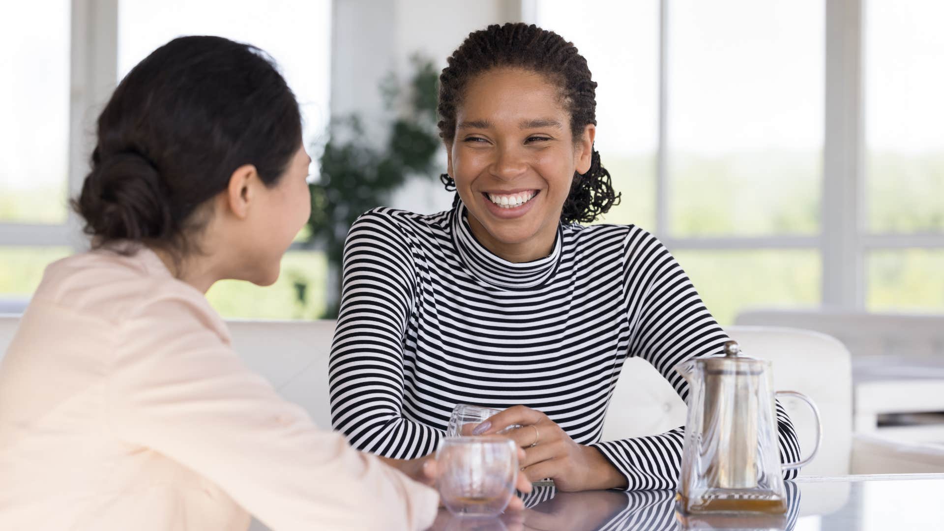 people-pleasing woman speaking to friend