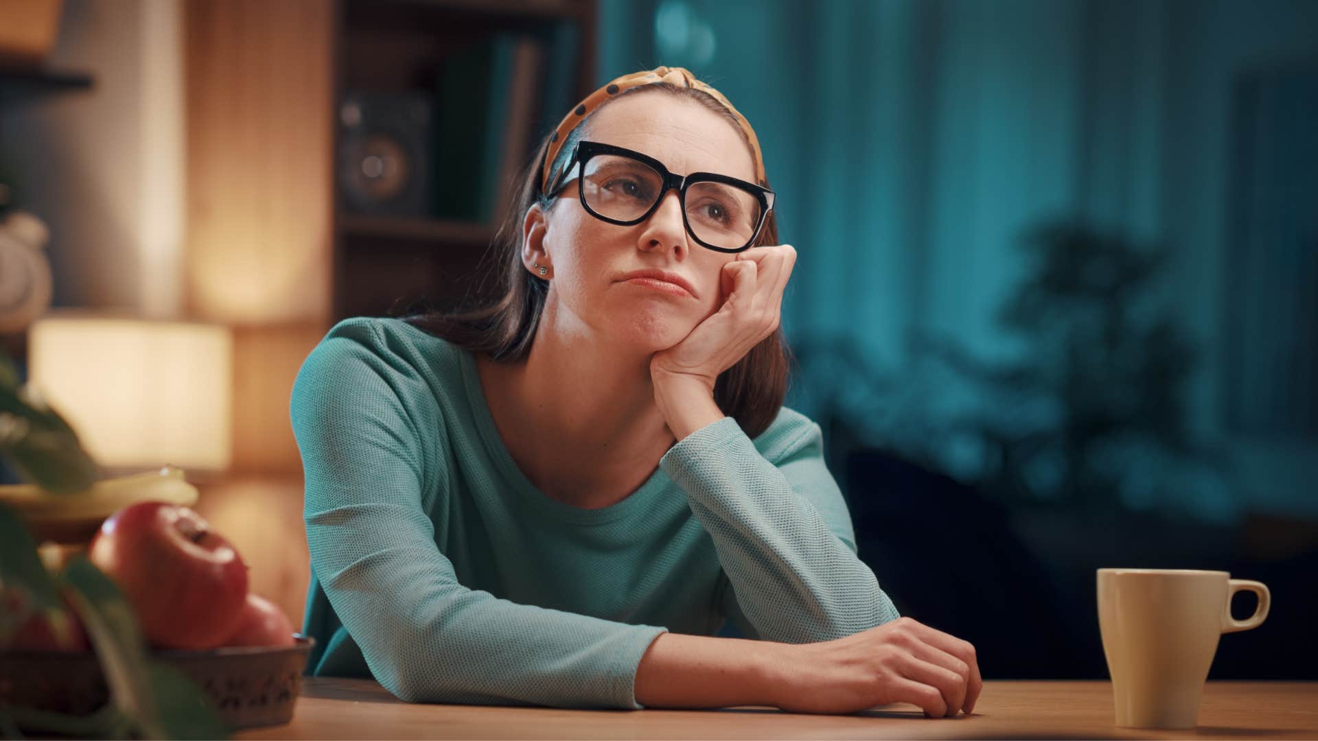 woman with decision fatigue thinking at home