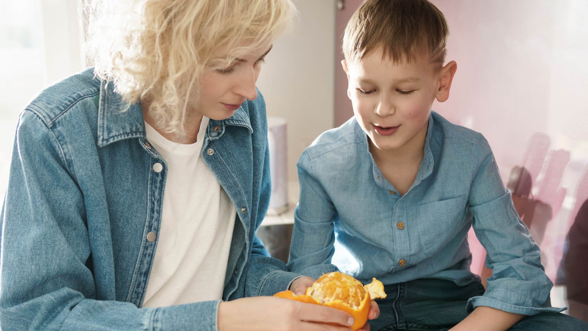 mom and son sharing food due to money issues