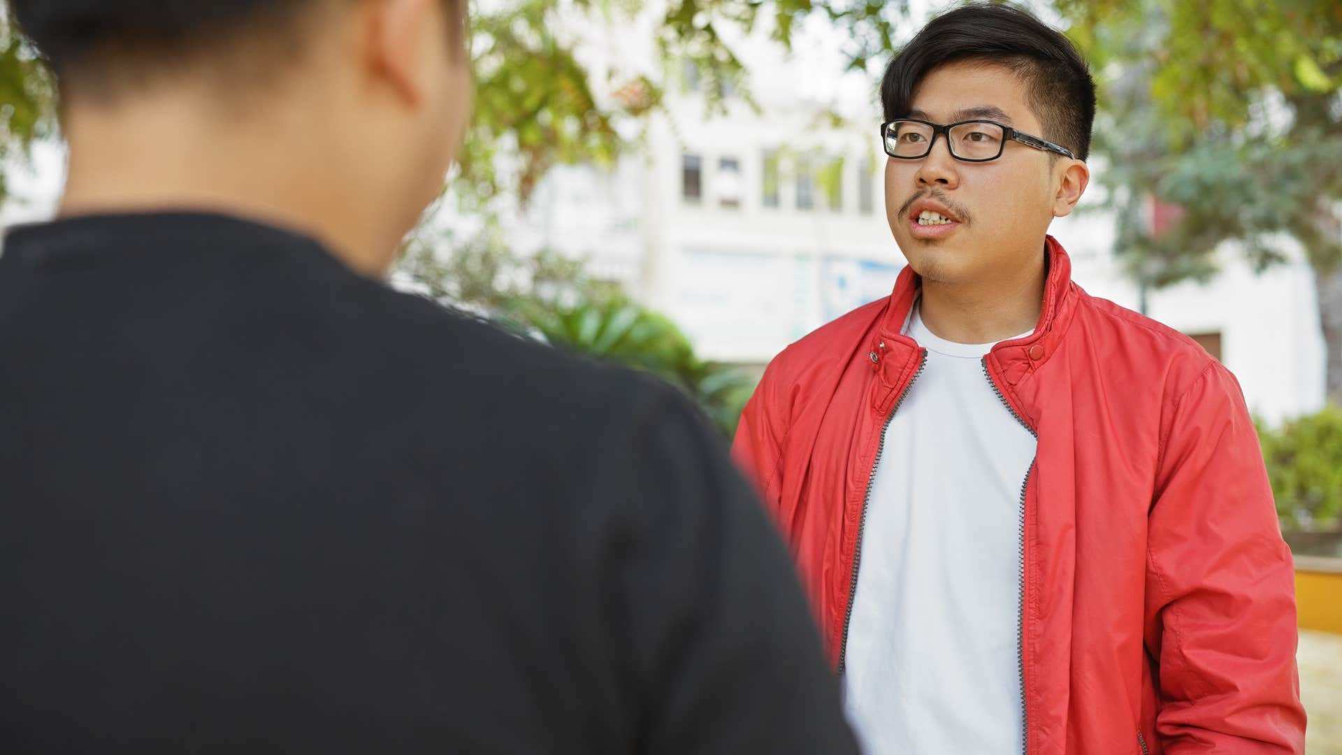 Man saying "do whatever you want" to an upset friend.