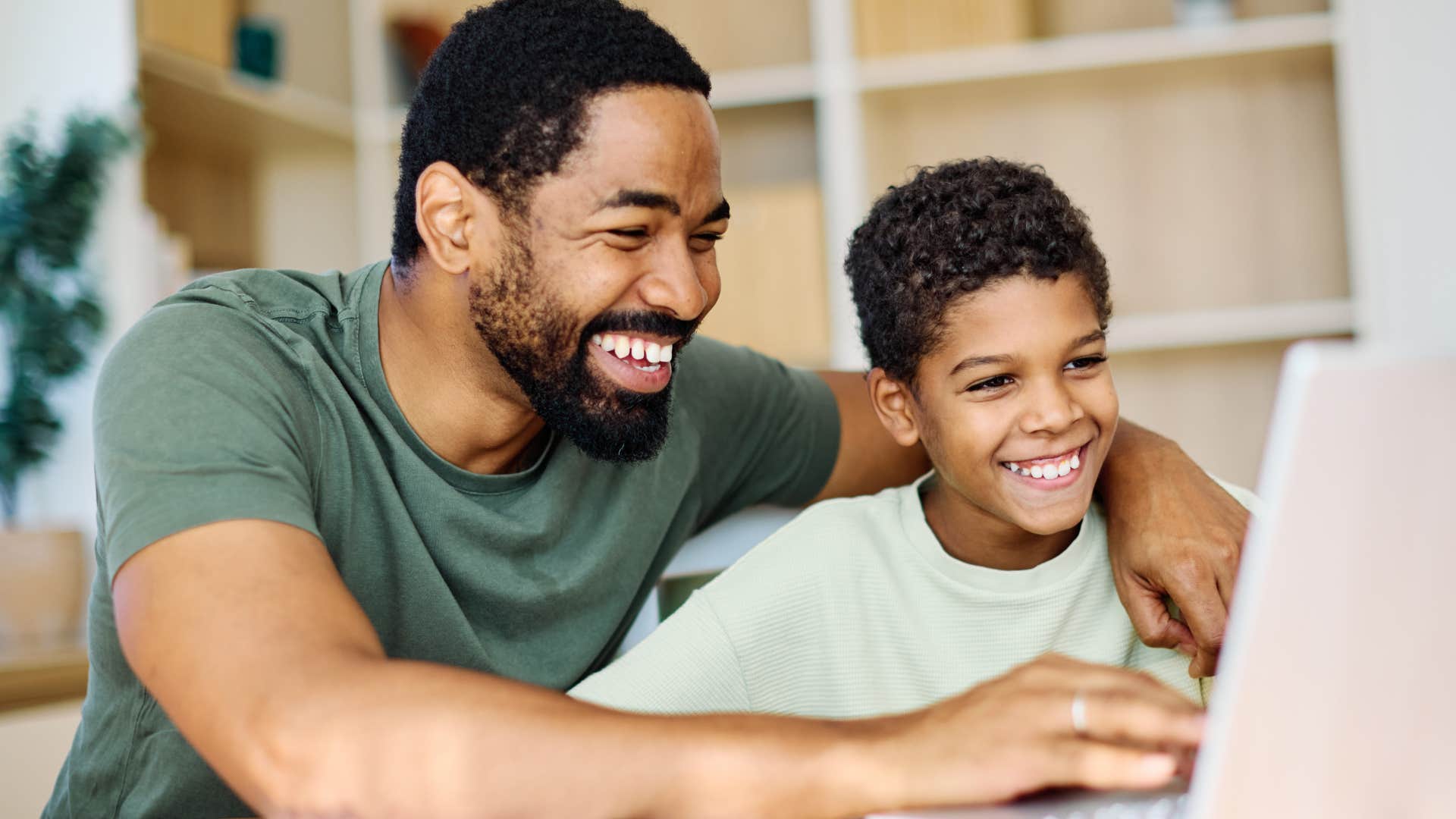 family-oriented man smiling with his son