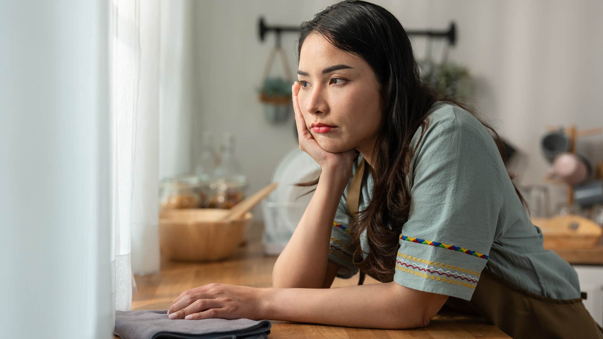 woman who's not a perfectionist cleaning at home