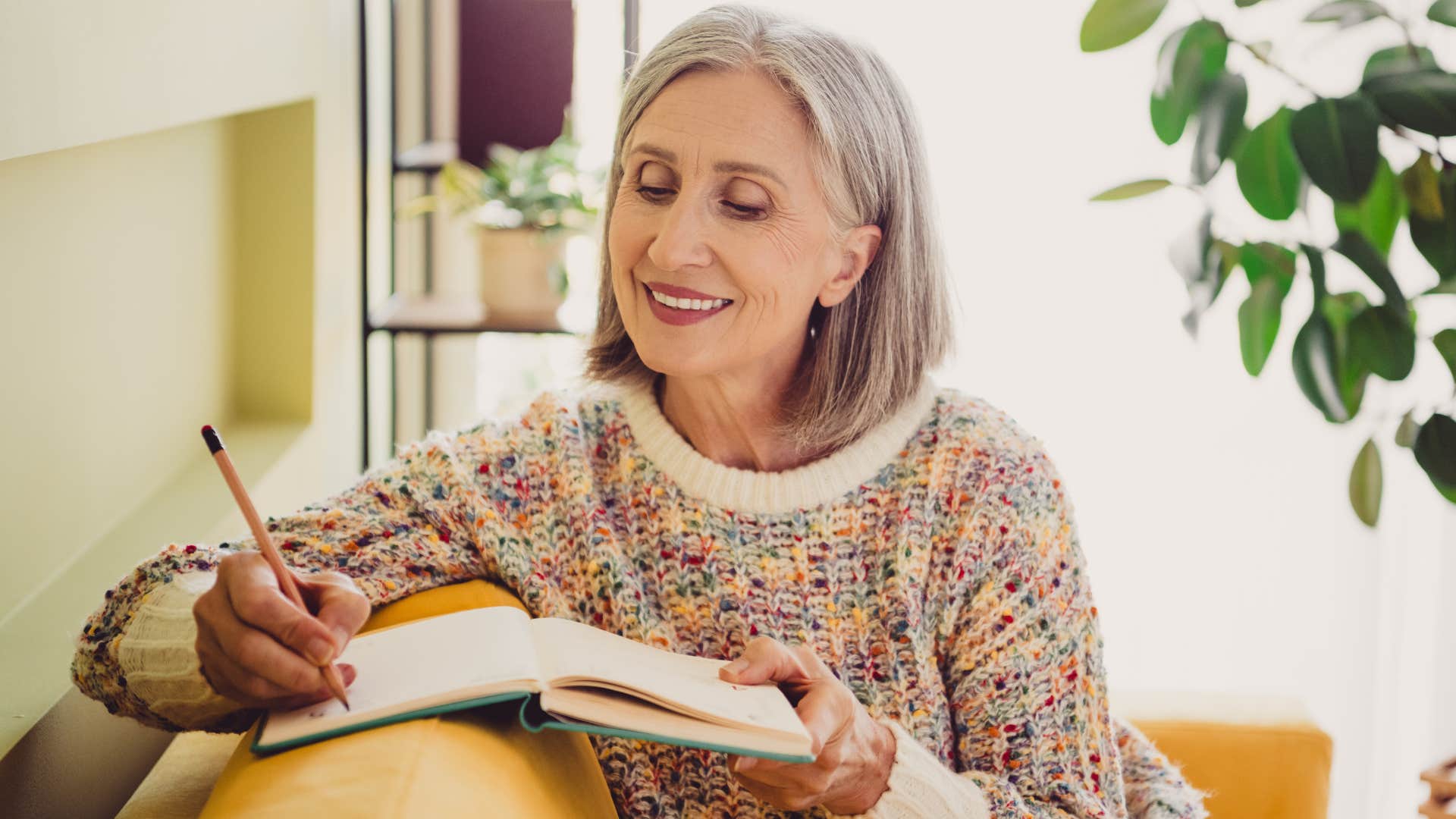 Focused person writes about what is important showing emotional gift