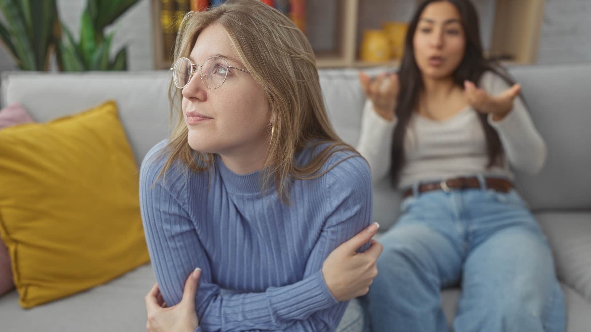 woman turned away from friend saying I'm sorry you feel that way