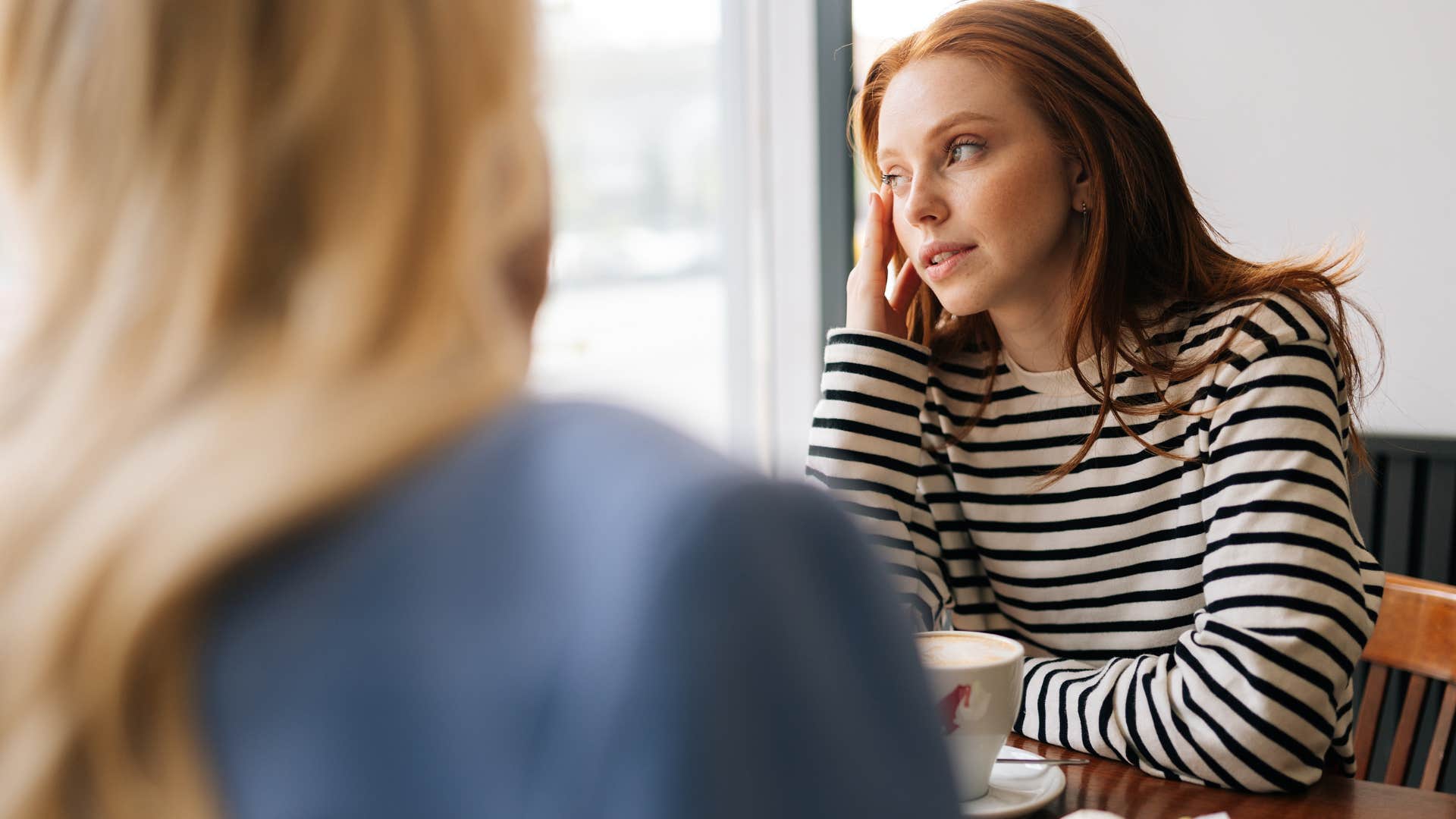 rude woman saying that's not my problem to her friend