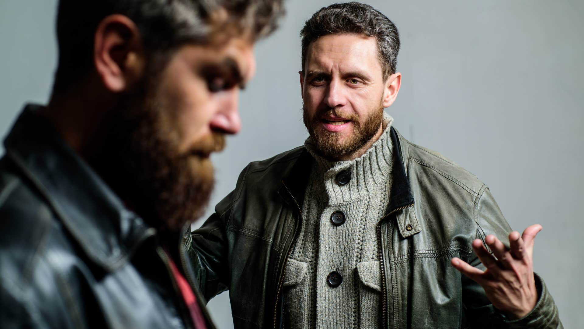 upset man confronting friend saying you're so fake