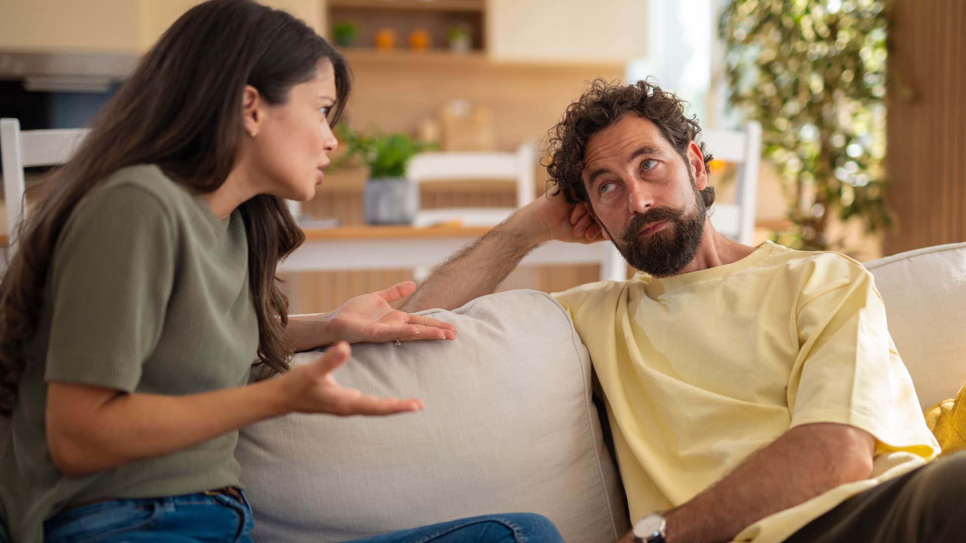 Man saying "that sucks" to his upset wife.