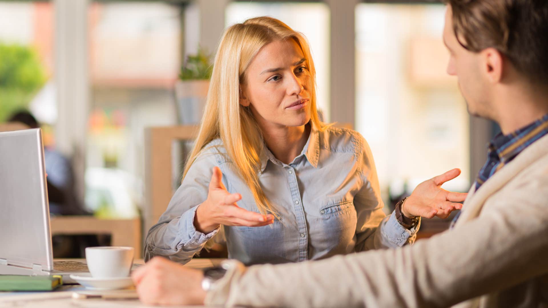 Woman saying "Who do you know?" to someone at work.