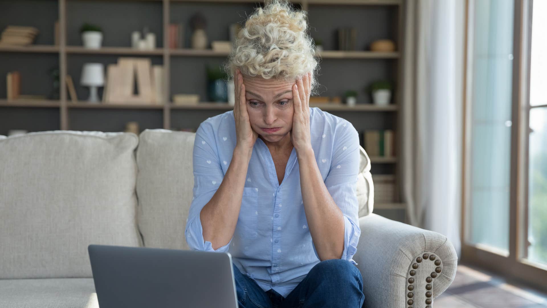Frustrated person with computer ready to delete ex showing way to let go after breakup