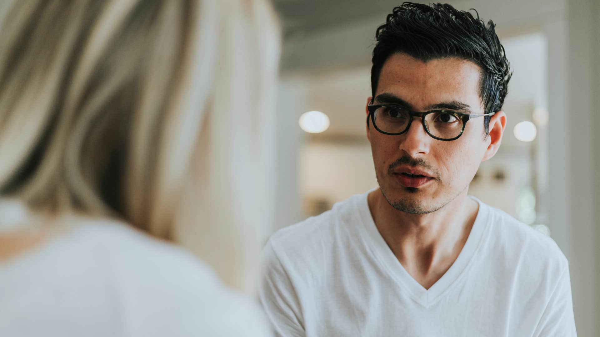 Man who gives unsolicited advice looking at his partner.