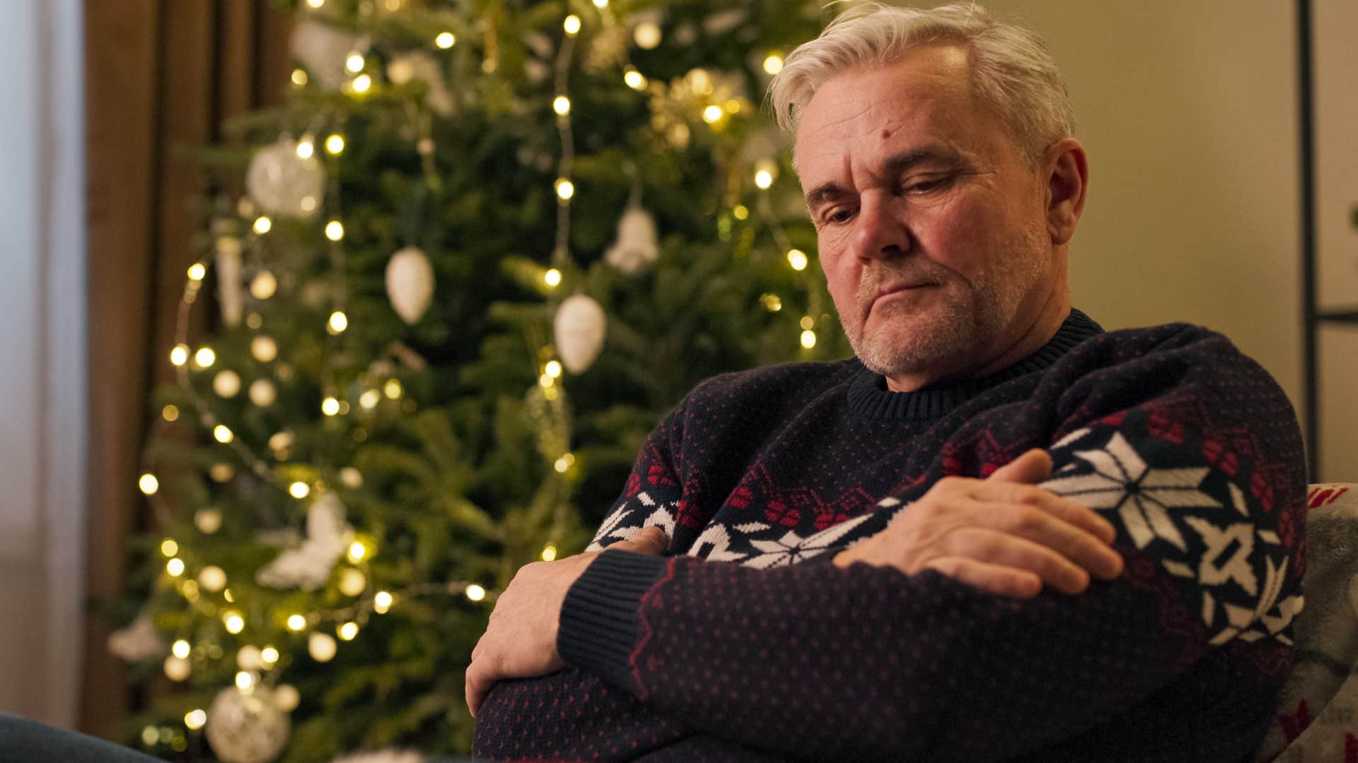 Man who holds onto grudges looking upset.