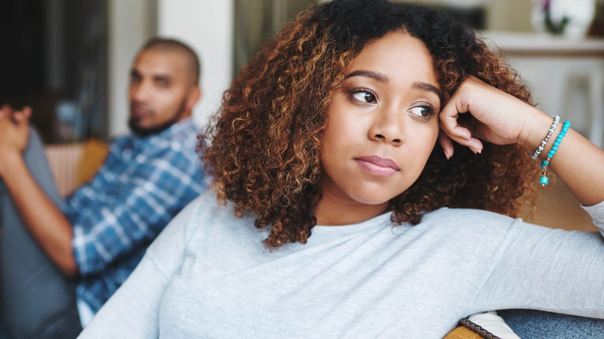Woman who keeps score in relationships turned away from her partner.