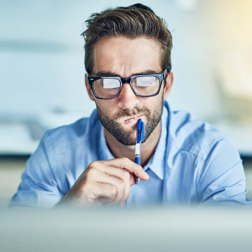 man focusing while working on laptop