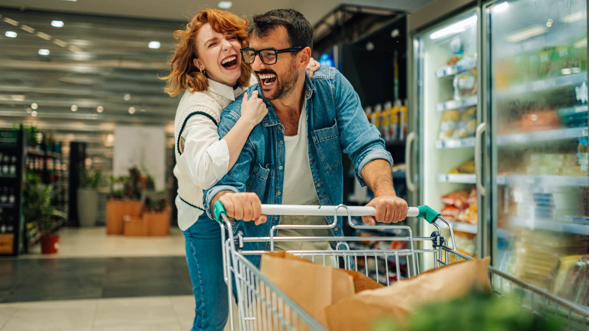 Light hearted couple laugh while shopping showing cherished behavior