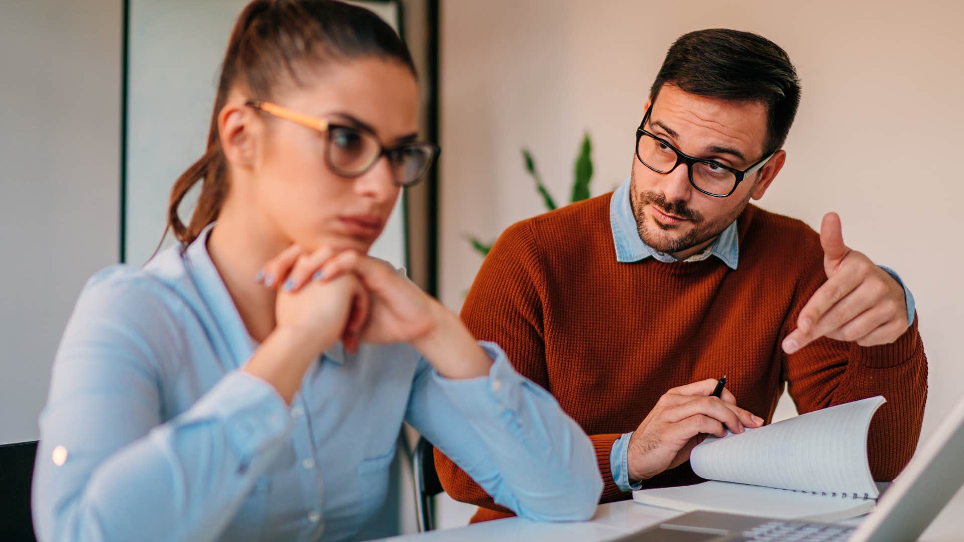 man trying to sound smart saying it's actually simple if you understand it correctly to annoyed co-worker