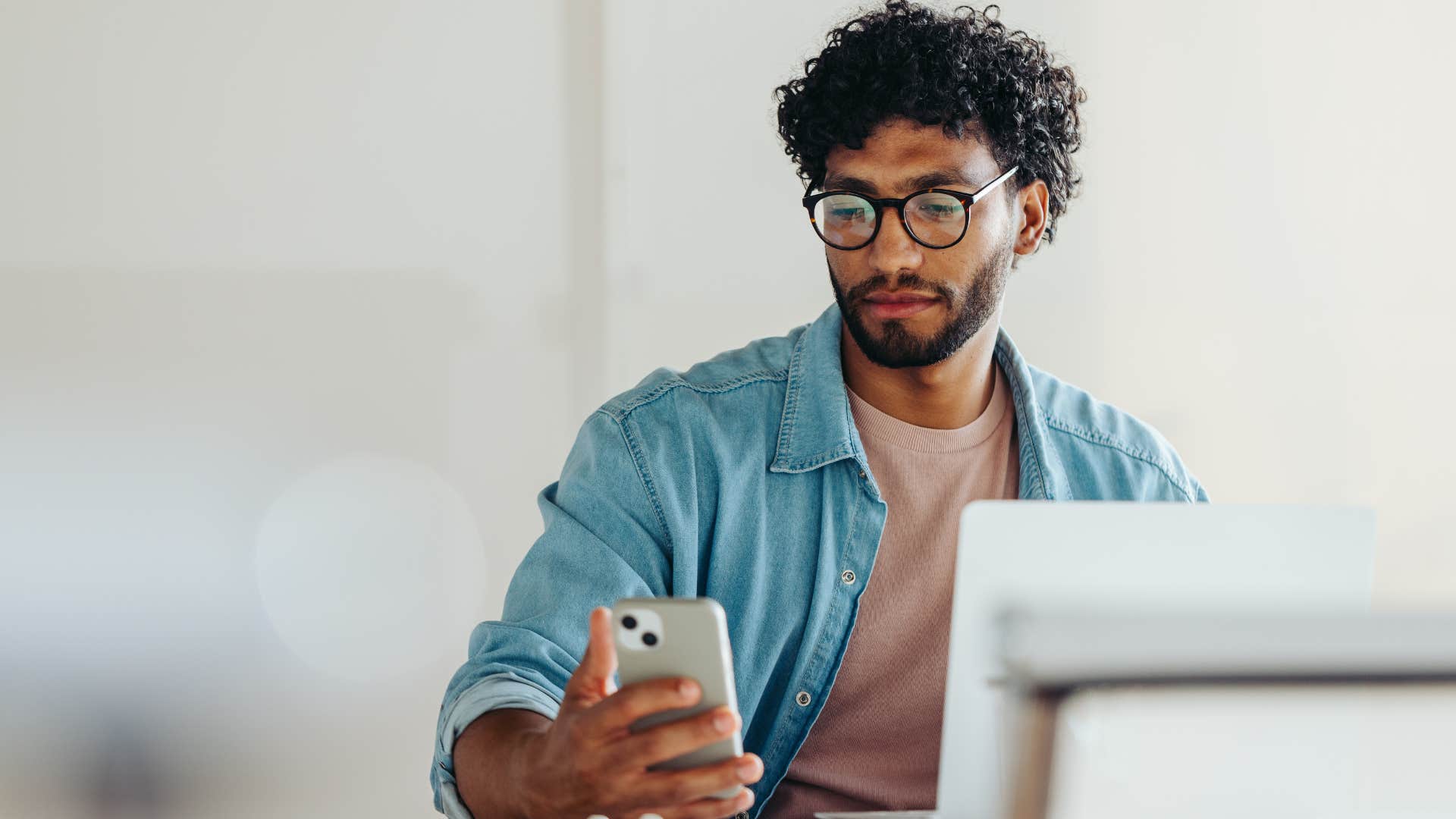 man looking at his phone