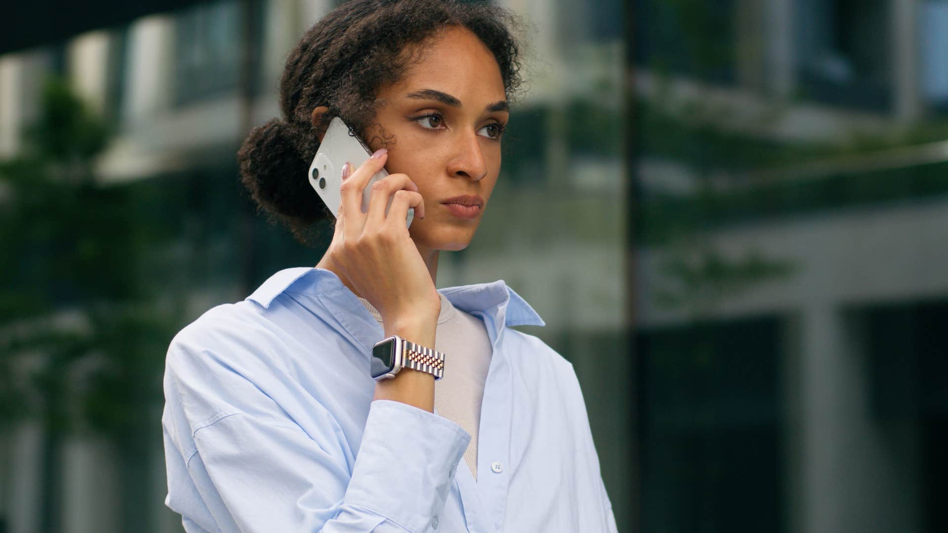 woman coping with awkward silence by talking on the phone