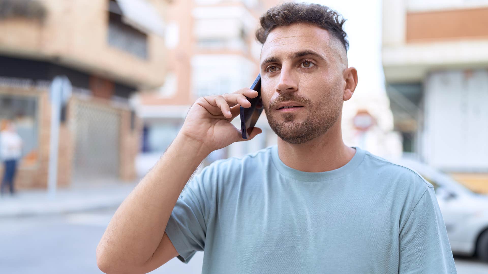 man talking on the phone while walking to cope with discomfort