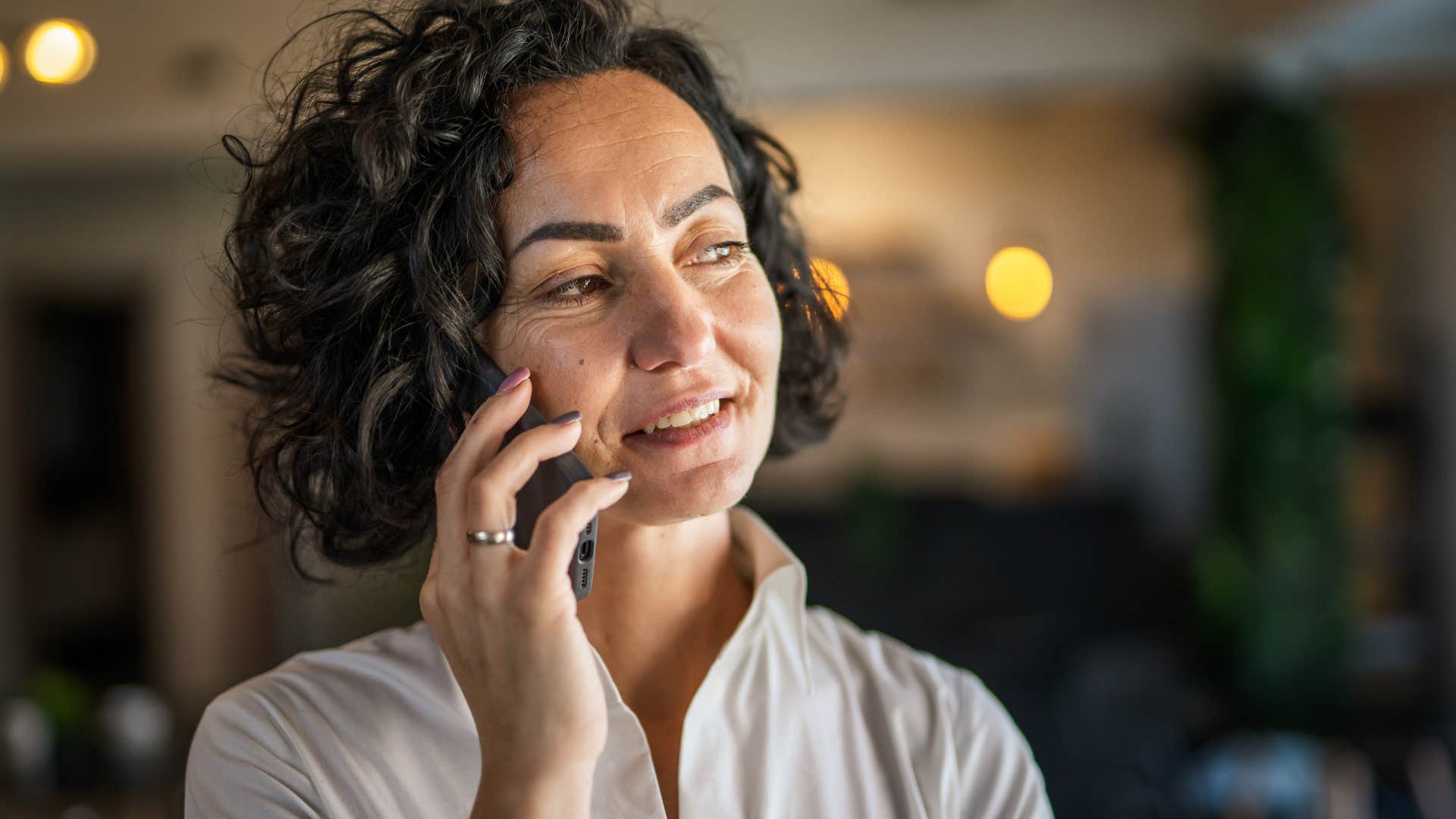 woman talking on a phone to prevent boredom