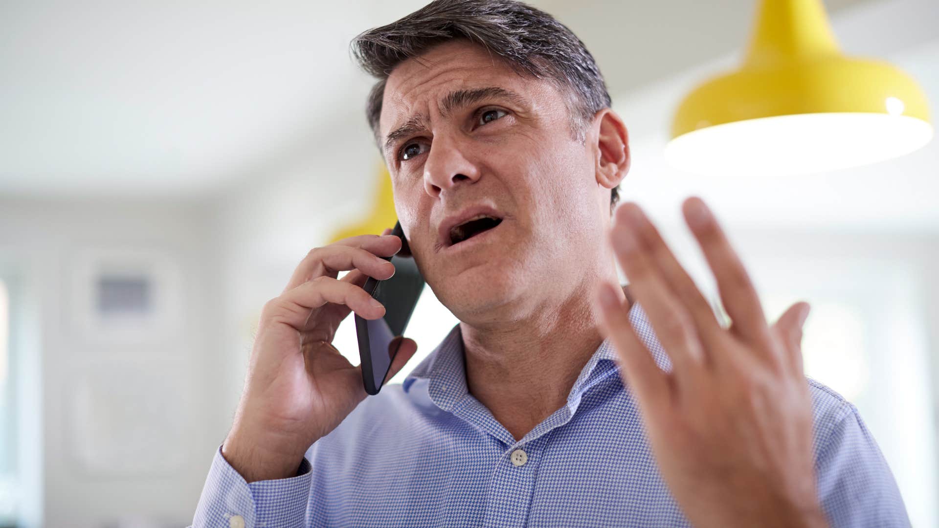 man trying to form better sentences while talking on his phone