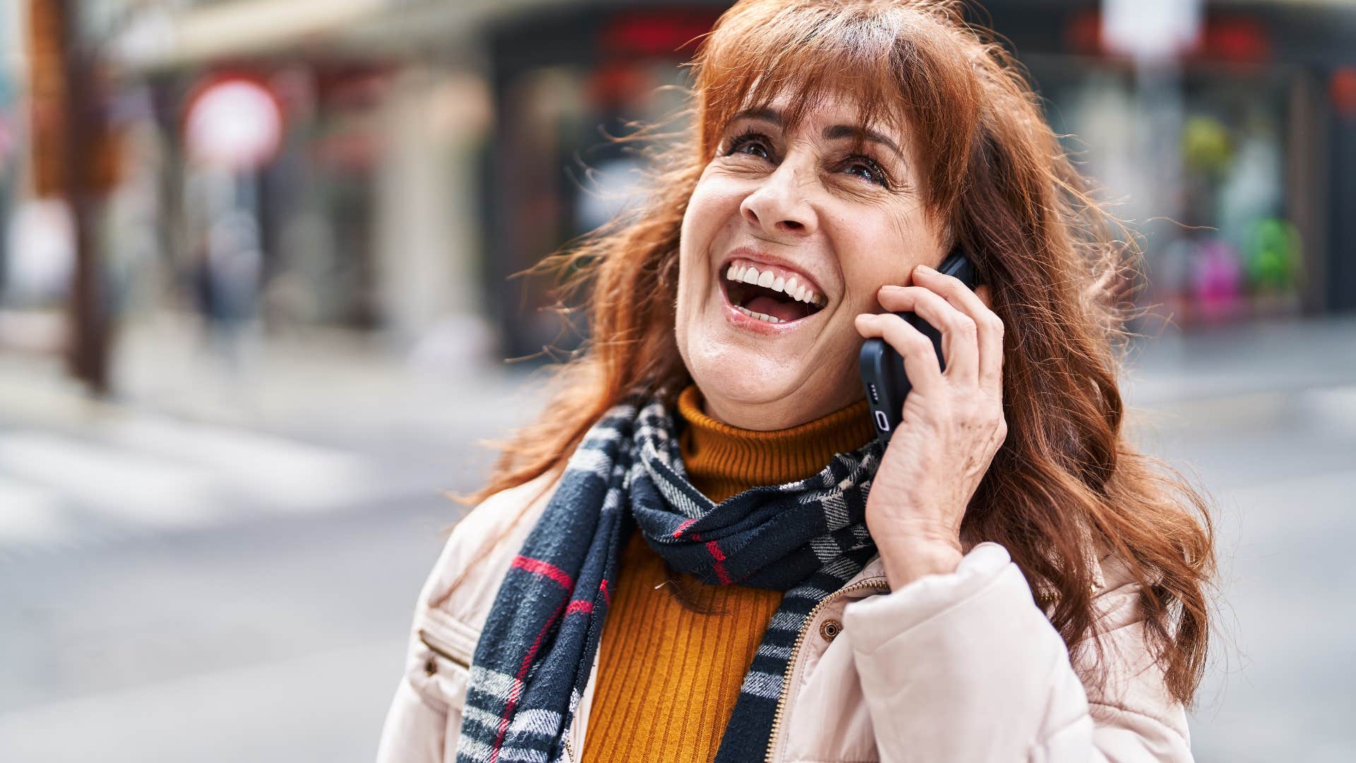 woman trying to be more engaged while talking on the phone