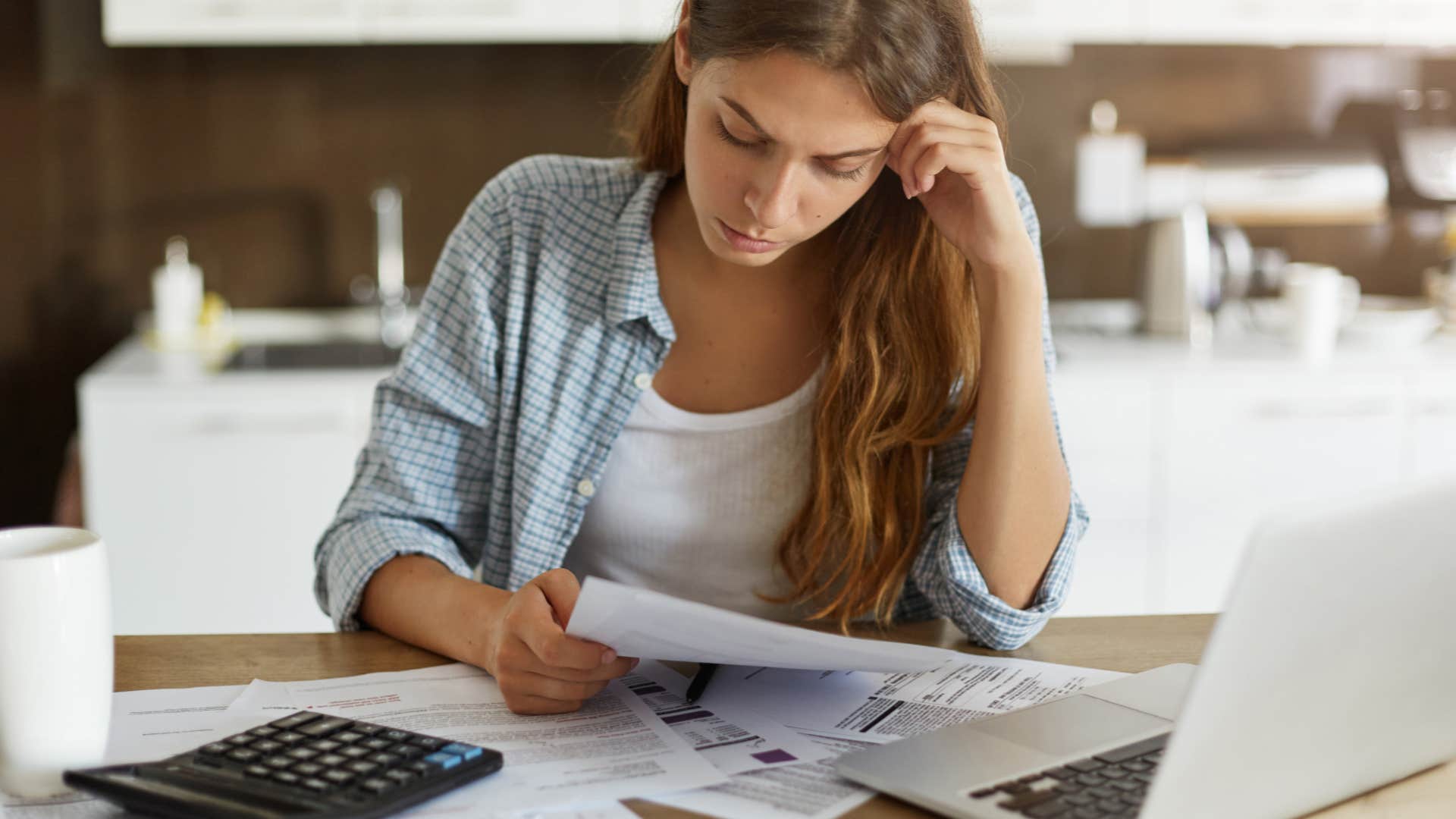 conscientious woman looking over papers