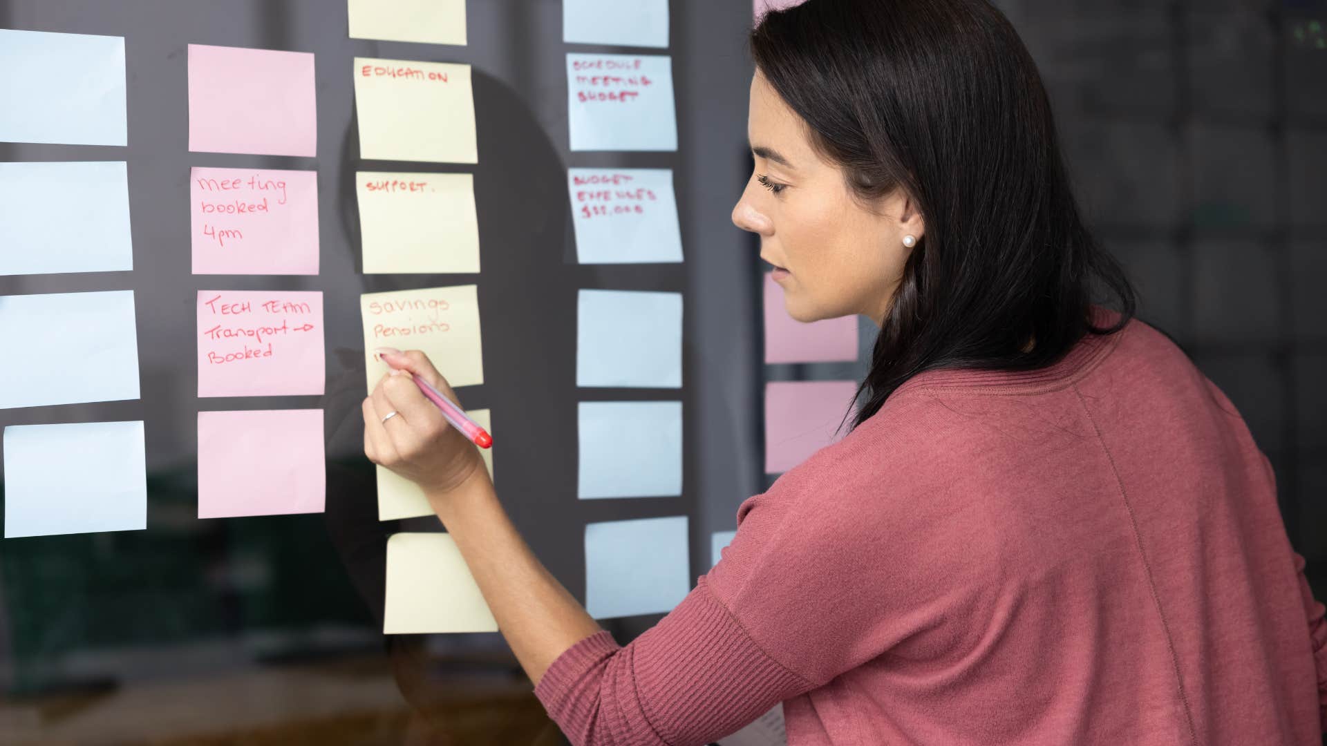 woman juggling multiple tasks planning everything out
