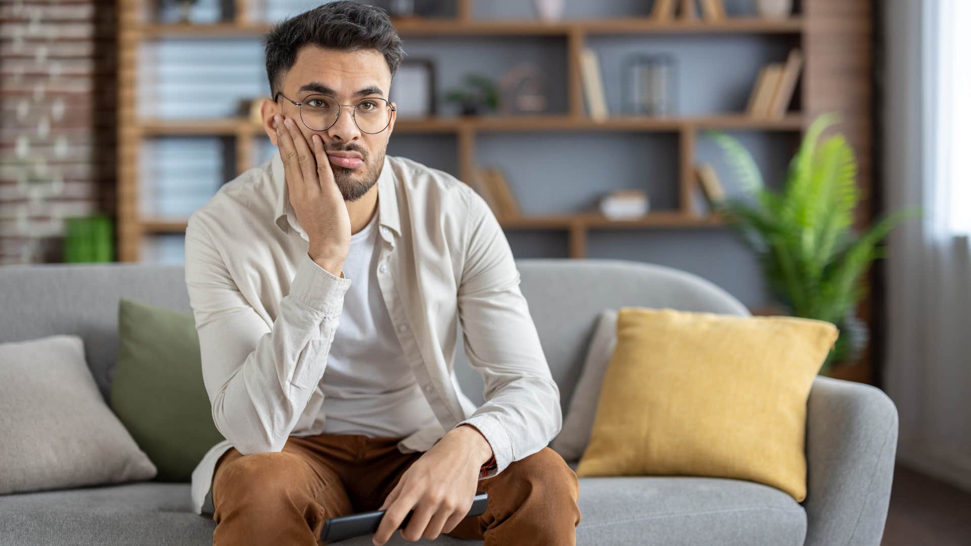 man resistant to monotony sitting at home alone