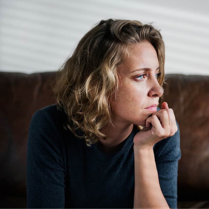 Woman sitting in silence at home.