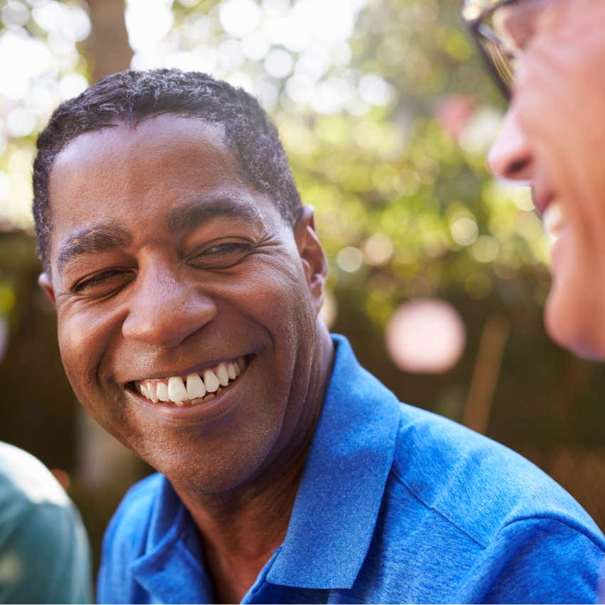 Man being silent in certain situations with friends.