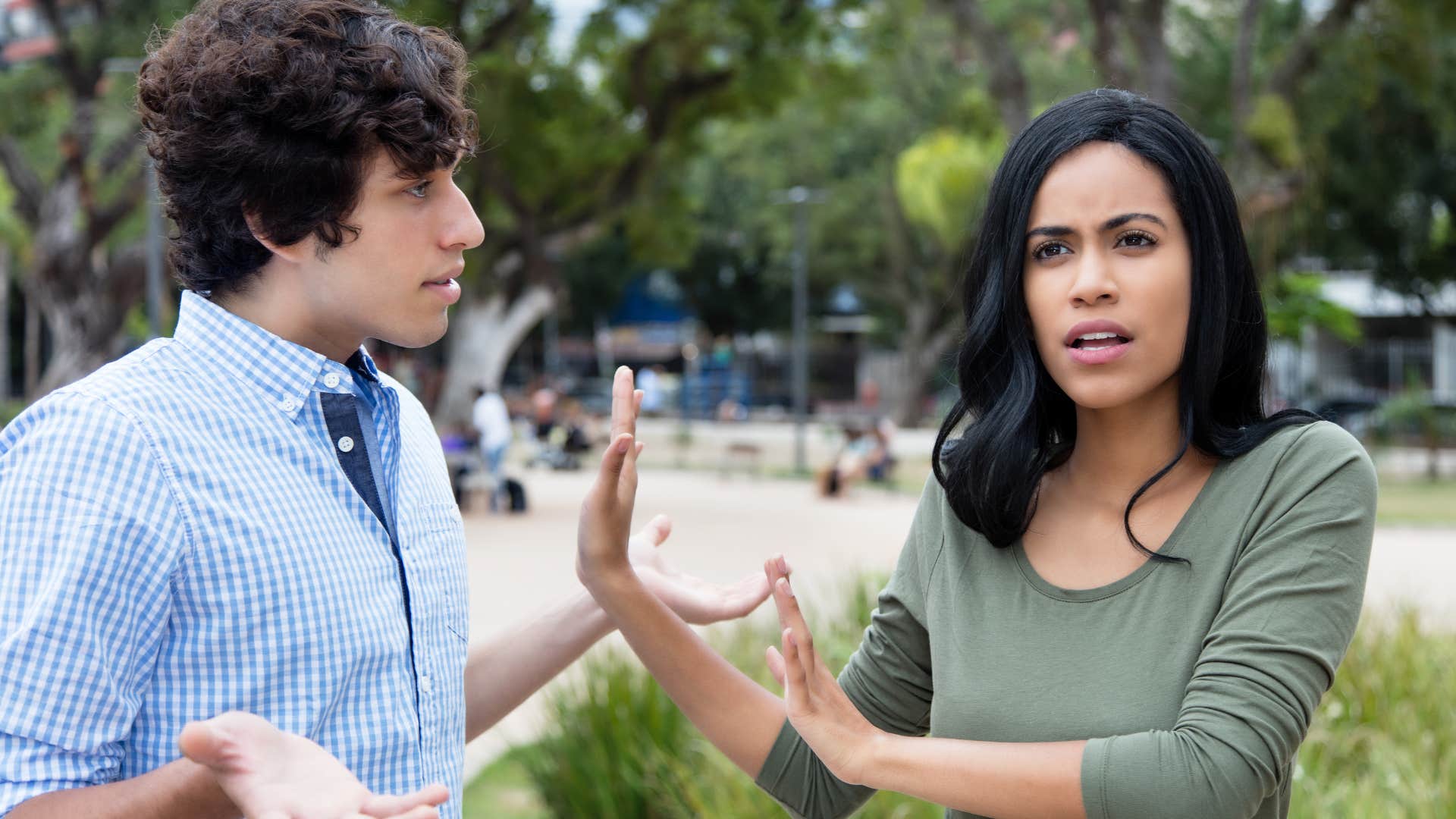 woman shirking man off saying that's not my problem