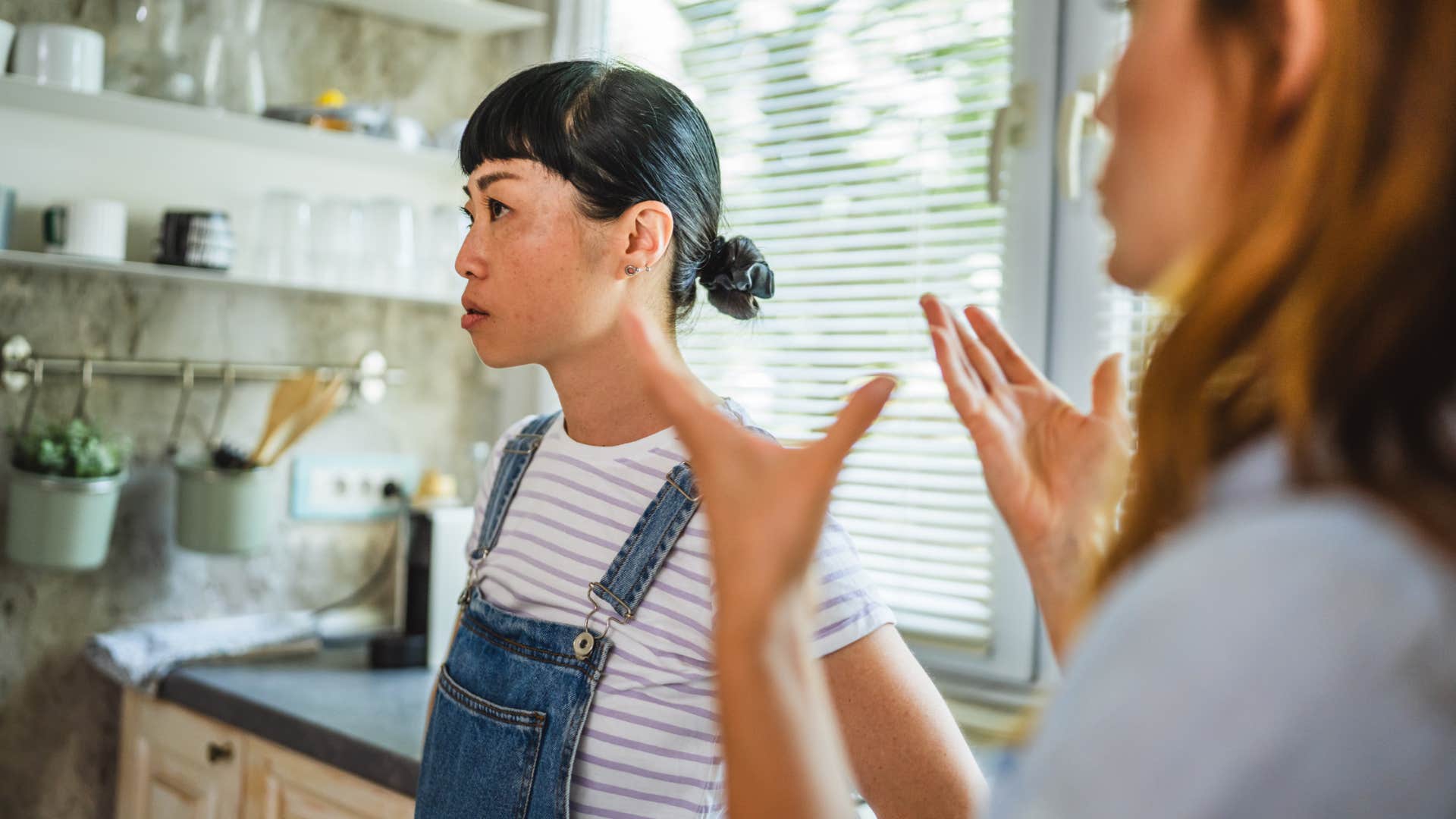 rude woman with zero common sense turned away from friend after saying i'm not talking about that