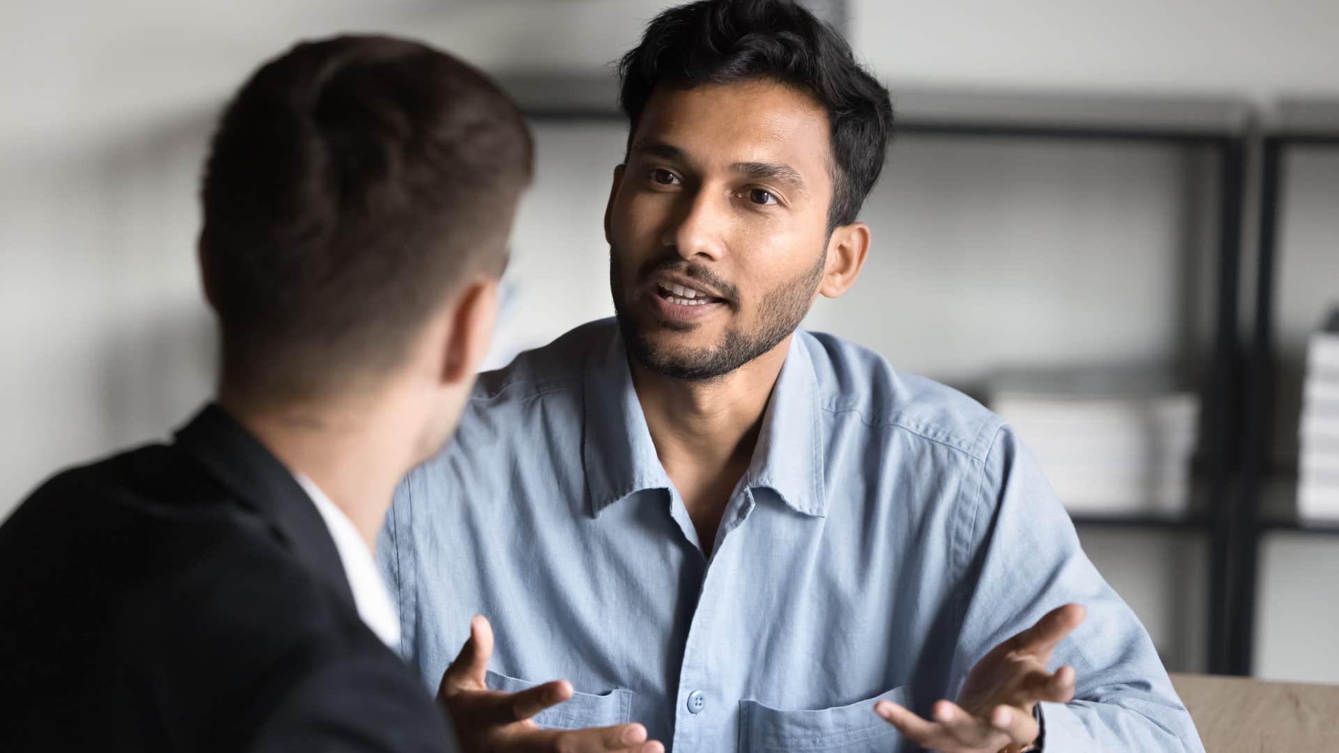 Man saying that's not my responsibility at work