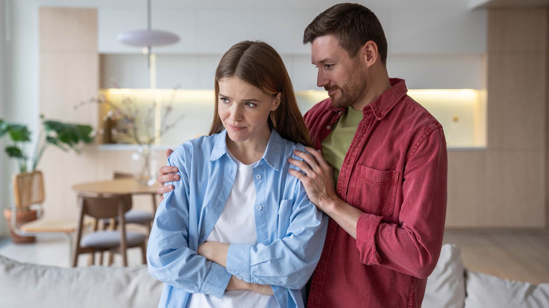 man with zero empathy telling woman to calm down