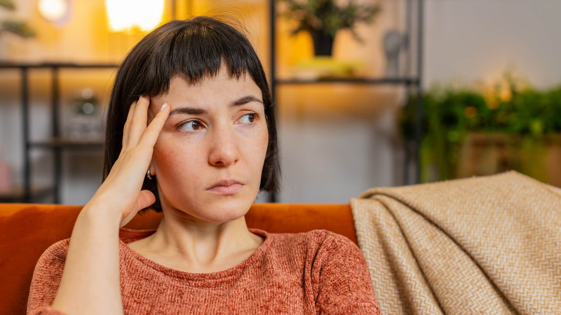 Sad woman touches head in thought showing need to be saved never attracts men
