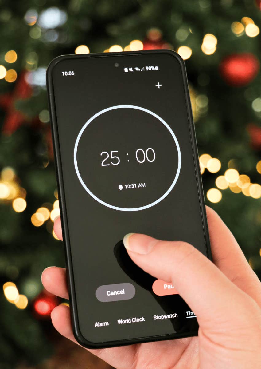 hand holding phone screen with timer on it