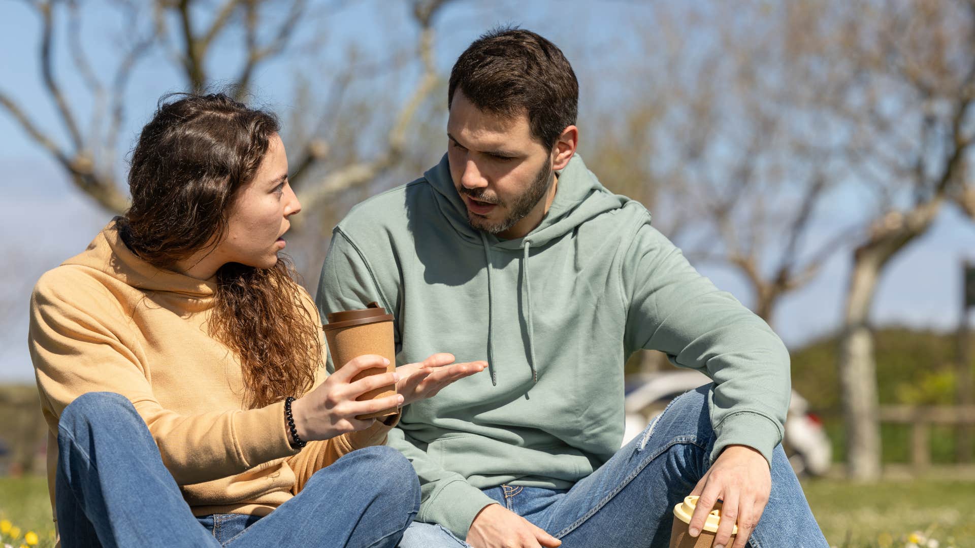 couple talking woman telling man at the end of the day cutting him off