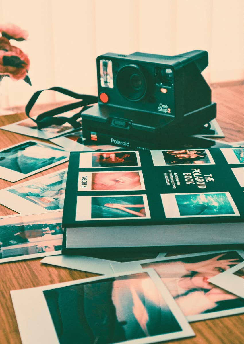 polaroid camera and photo album