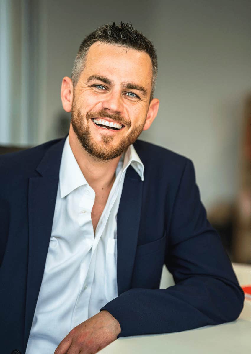 professional man smiling brightly because he is truly happy