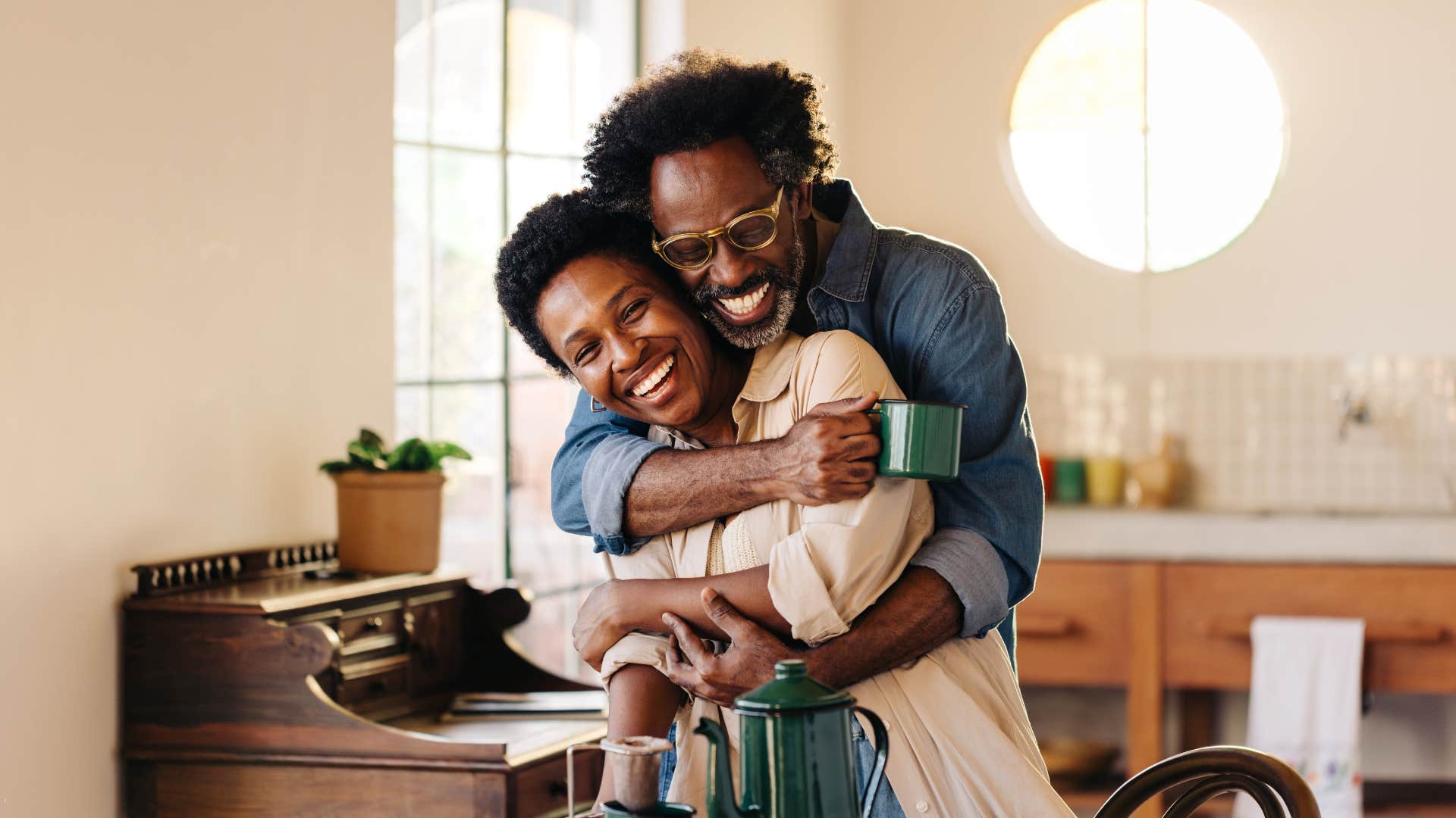 Joyous couple hug showing way to be happier in marriage