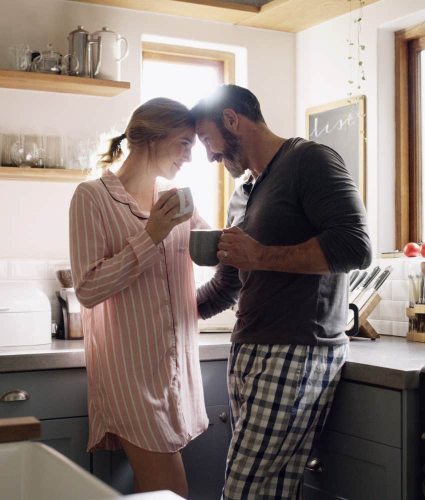 Loving couple stand forehead to forehead showing habit to build lifelong marriage