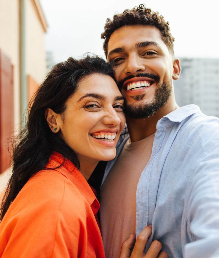 Jotful couple embrace showing solid marraige